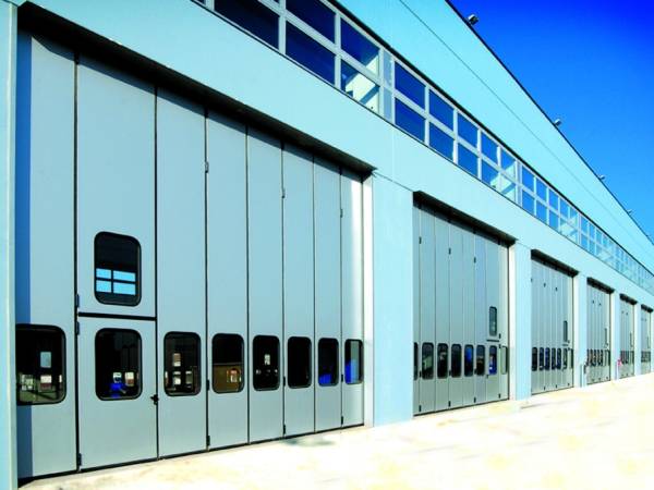 Aprico PORTONI INDUSTRIALI A LIBRO